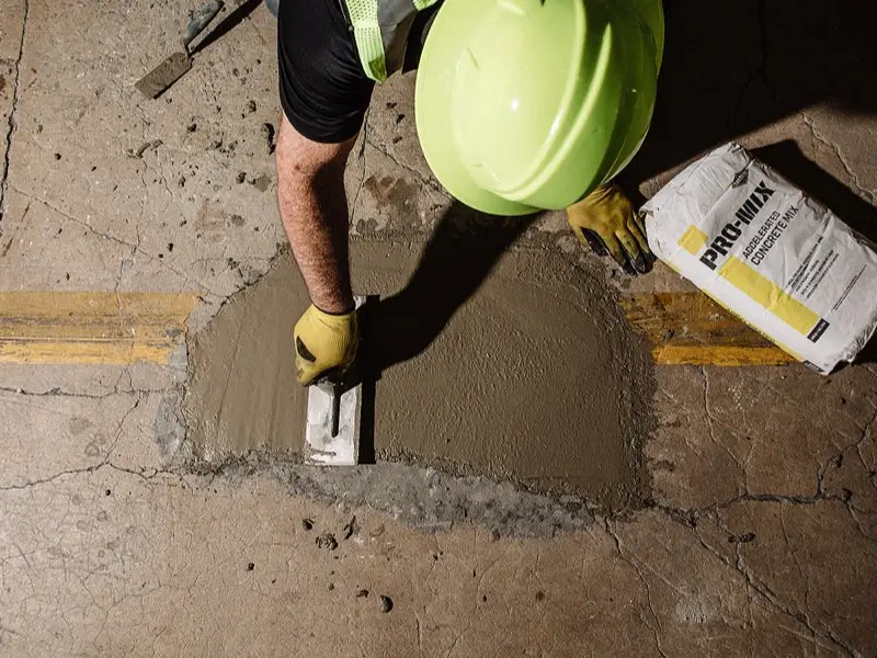 Rodney Concrete concrete repairs team fixing cracked pavement. Rodney Concrete concrete repairs team fixing cracked pavement.